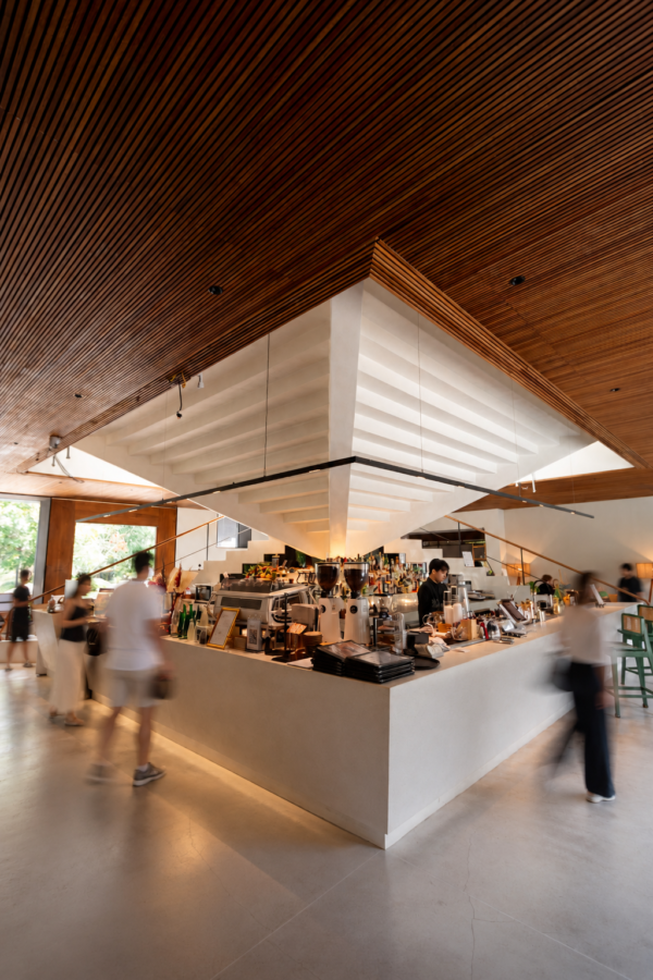 Tree O’Clock Phuket café interior with a central coffee counter, timber ceiling, and natural light